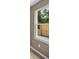 Close up of the window showing the light colored walls, hardwood flooring and view of the fenced in yard at 429 W Carolina Ave, Deland, FL 32720