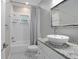 Bathroom featuring a tub and shower combo and modern single sink vanity at 431 S Stone St, Deland, FL 32720