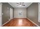 Spacious bedroom features hardwood floors, modern ceiling fan, and natural light at 431 S Stone St, Deland, FL 32720