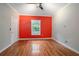 Cozy bedroom with hardwood floors and a window that fills the room with natural light at 431 S Stone St, Deland, FL 32720