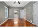 Bedroom with hardwood flooring leading into the bathroom, with double sink at 431 S Stone St, Deland, FL 32720