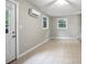 Bedroom featuring tile floors, a ceiling fan, mini-split system, and natural light at 431 S Stone St, Deland, FL 32720