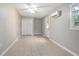 Bedroom featuring tile floors, a ceiling fan, mini-split system, and a closet at 431 S Stone St, Deland, FL 32720