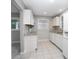 A bright kitchen features sleek white cabinets and granite countertops, offering modern style at 431 S Stone St, Deland, FL 32720