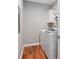 Compact laundry room with modern washer, dryer, and convenient storage space at 431 S Stone St, Deland, FL 32720