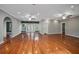 Open-concept living area with hardwood floors, recessed lighting, gray walls, and access to the outdoor living at 431 S Stone St, Deland, FL 32720