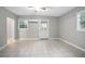 An airy living room offers tile floors, a cooling ceiling fan, and natural light at 431 S Stone St, Deland, FL 32720