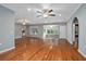 Expansive living room showcasing hardwood floors, gray walls, and arched entryways at 431 S Stone St, Deland, FL 32720