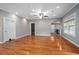 Spacious living room featuring hardwood floors, neutral gray walls, and recessed lighting at 431 S Stone St, Deland, FL 32720