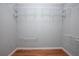A large walk-in closet offers ample storage with multiple shelves and hanging rods at 431 S Stone St, Deland, FL 32720