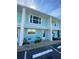 Exterior view of the updated and painted condo unit with a white frame and a blue painted surface at 4786 S Atlantic Ave # 3, Ponce Inlet, FL 32127