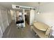 Modern kitchen and dining area featuring a breakfast bar, stainless steel appliances, and wood floors at 4786 S Atlantic Ave # 3, Ponce Inlet, FL 32127