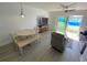 Comfortable living and dining area featuring wood floors and access to the outdoor space at 4786 S Atlantic Ave # 3, Ponce Inlet, FL 32127