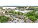 Aerial view of the community featuring lush landscaping, trees, and nearby shopping at 511 Polaris Loop # 105, Casselberry, FL 32707