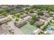 An aerial view of the community featuring a tennis court, pool, and well-maintained landscaping at 511 Polaris Loop # 105, Casselberry, FL 32707