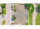 Aerial view of the community's roofline with parking and roads nearby at 511 Polaris Loop # 105, Casselberry, FL 32707
