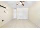 This bedroom features tile flooring, a ceiling fan, closet, and neutral paint at 511 Polaris Loop # 105, Casselberry, FL 32707
