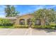 Lovely exterior view of condo featuring manicured landscaping and arched entryway at 511 Polaris Loop # 105, Casselberry, FL 32707