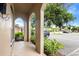 Porch with arched columns overlooking the street, showcasing nearby landscaping at 511 Polaris Loop # 105, Casselberry, FL 32707