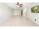Spacious living room with modern ceiling fan and tile floors, ready for customization at 511 Polaris Loop # 105, Casselberry, FL 32707