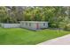Charming home featuring a spacious front yard with a freshly manicured lawn and clean light green exterior paint at 528 Pine St, Daytona Beach, FL 32114