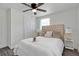 Comfortable bedroom with a ceiling fan, neutral color palette, ample lighting, and closet space at 528 Pine St, Daytona Beach, FL 32114
