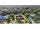 Aerial shot of the property nestled among mature trees in a quiet neighborhood at 5759 Dogwood Rd, Port Orange, FL 32127