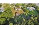 The home's backyard features a quaint outbuilding and garden providing an idyllic setting at 5759 Dogwood Rd, Port Orange, FL 32127
