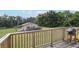 Enjoy backyard views from the wooden deck, complete with a grill at 5759 Dogwood Rd, Port Orange, FL 32127