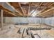 Unfinished basement with concrete block walls and open ceiling at 5759 Dogwood Rd, Port Orange, FL 32127