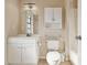Bathroom with white vanity, mirrored cabinet, and shower/tub combo with white tile at 5759 Dogwood Rd, Port Orange, FL 32127