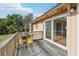 The wooden deck provides outdoor living space, with a grill and access to the interior at 5759 Dogwood Rd, Port Orange, FL 32127