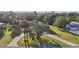 Inviting front yard view surrounded by beautiful trees and landscaping; home set back from street at 5759 Dogwood Rd, Port Orange, FL 32127