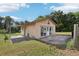 The exterior of the detached suite has multiple entries and a concrete patio at 5759 Dogwood Rd, Port Orange, FL 32127