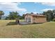 The detached in-law suite has a private entrance, large windows, and is nestled in the backyard at 5759 Dogwood Rd, Port Orange, FL 32127