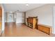 Living room featuring wood floors with an open doorway and a white door leading to the outside at 5759 Dogwood Rd, Port Orange, FL 32127