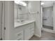 Bathroom with white vanity and mirror with walk-in shower at 600 N Boundary Ave # 420, Deland, FL 32720