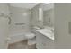Bright bathroom featuring a tub shower combo, white sink and vanity at 600 N Boundary Ave # 420, Deland, FL 32720
