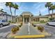 A charming clubhouse surrounded by a well-manicured lawn and flowering shrubs at 600 N Boundary Ave # 420, Deland, FL 32720