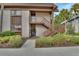 Inviting condo exterior with well-kept landscaping, stairs and neutral siding at 600 N Boundary Ave # 420, Deland, FL 32720