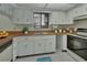 Functional kitchen features white cabinets and modern appliances at 600 N Boundary Ave # 420, Deland, FL 32720