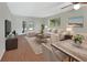 Bright living area with French doors, wood floors, and stylish furniture at 600 N Boundary Ave # 420, Deland, FL 32720