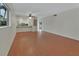 Open living space with wood floors and view of the kitchen area at 600 N Boundary Ave # 420, Deland, FL 32720
