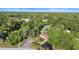 Aerial image showcases the home and its location within a vibrant, tree-filled neighborhood at 611 N Garfield Ave, Deland, FL 32724
