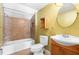 This is a bathroom with tiled shower-tub combo and wooden vanity at 611 N Garfield Ave, Deland, FL 32724