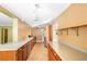 Long kitchen with stainless appliances and tile flooring at 611 N Garfield Ave, Deland, FL 32724
