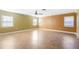 This living room features large windows for natural light, tile floors, and neutral-colored walls at 611 N Garfield Ave, Deland, FL 32724