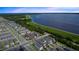 Stunning aerial view of neighborhood near a large lake, showcasing homes and natural beauty at 614 Becklow St, Debary, FL 32713