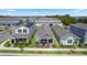 Aerial view showcasing a property with manicured landscaping, a covered porch, and convenient parking at 614 Becklow St, Debary, FL 32713