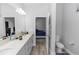 Well-lit bathroom with neutral tones, dual vanity, and convenient toilet room at 614 Becklow St, Debary, FL 32713